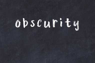 Siyah masada elle yazılmış tebeşir yazısı belirsizliği