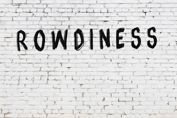 Üzerinde yazı olan beyaz tuğla duvar, el yazısı ve siyah boya.