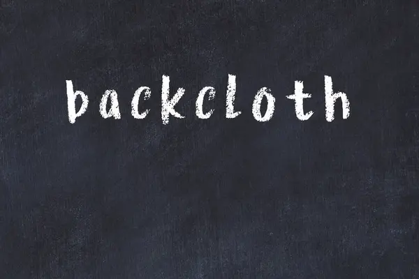 Tebeşir el yazısıyla yazılmış ters bez siyah masanın üzerine.