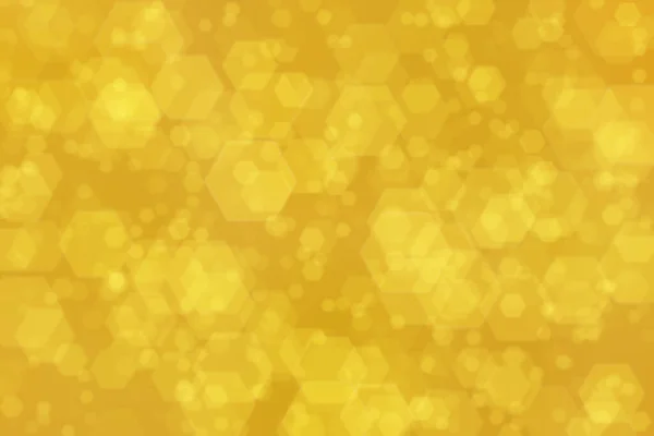 六角形のボケスポットを持つ黄金の抽象的背景 — ストック写真