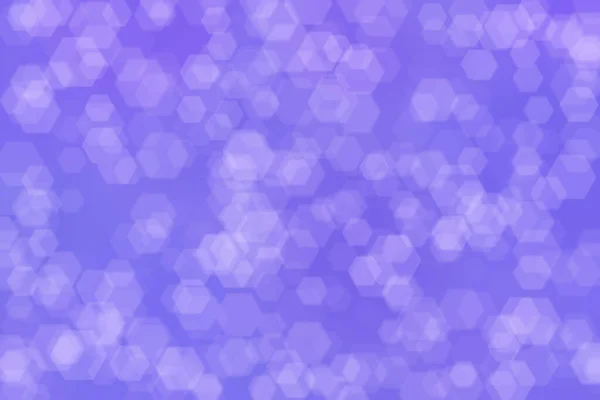 Abstract blurred light purple background with hexagon shaped spots.