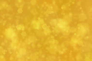 Altıgen şekilli bokeh benekleri ile odaklanmış altın soyut arkaplan