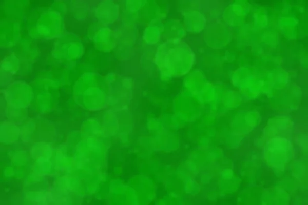 Deep vivid green colored abstract background bokeh.