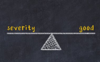 Şiddetle iyilik arasındaki denge. Kara tahtaya yazı tahtası çizimi