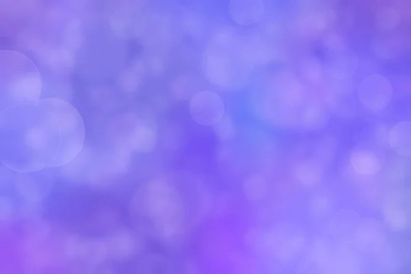 Abstract blurred light purple background with circle shaped spots.