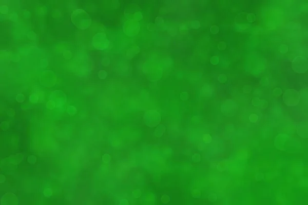 Deep vivid green colored abstract background bokeh.