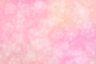 Çember şeklindeki bokeh benekleri ile odaklanmış pembe soyut arkaplan