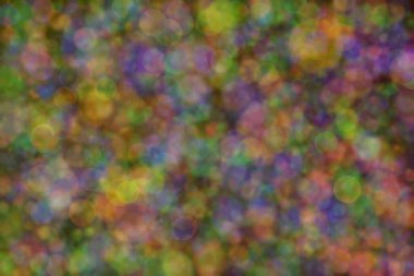 Bokeh ile soyut bir arkaplan. Yumuşak ışık odaklı noktalar.