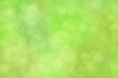 Altıgen şekilli bokeh benekli yeşil soyut odaklanmış arkaplan