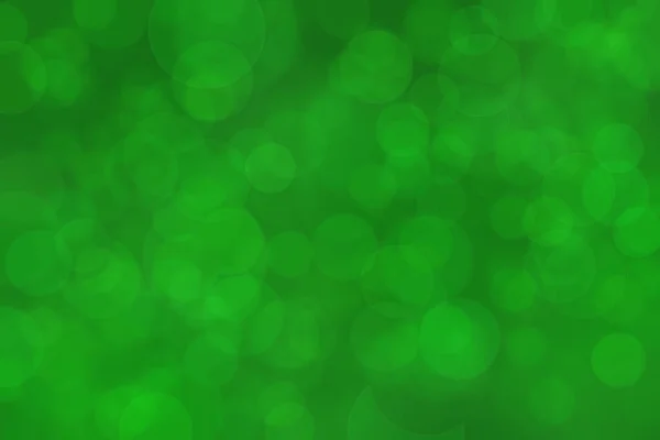 Deep vivid green colored abstract background bokeh.