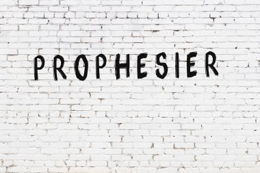 Beyaz tuğla duvara siyah boya ile yazılmış bir kehanet..