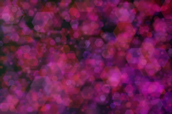 Purple and red hexagon defocused spots on black background. Abstract bokeh