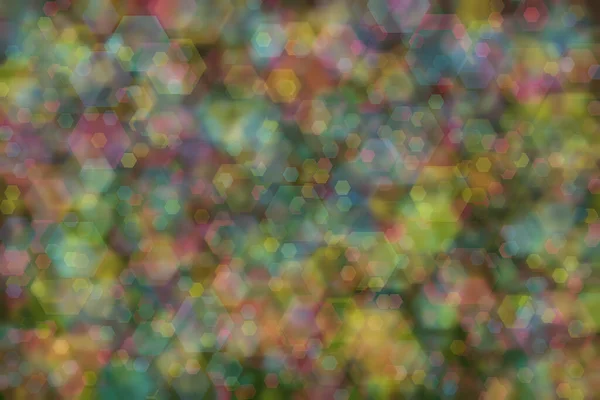blue, pink and yellow abstract defocused background with hexagon shape bokeh spots