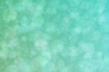 Aquamarine soyutlanmış çember şeklindeki bokeh noktalarıyla odaklanmış arkaplan