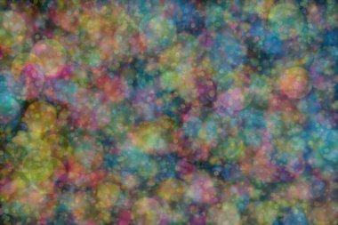 Bokeh ile soyut bir arkaplan. Yumuşak ışık odaklı noktalar.