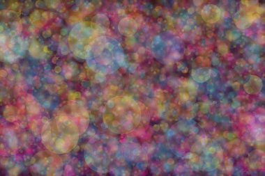 Birden fazla rengin soyut arkaplanı: mavi, pembe ve sarı ve bunların karışımı. Bokeh noktaları