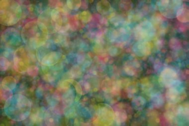 Bokeh ile soyut bir arkaplan. Yumuşak ışık odaklı noktalar.