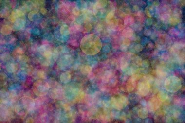 Birden fazla rengin soyut arkaplanı: mavi, pembe ve sarı ve bunların karışımı. Bokeh noktaları