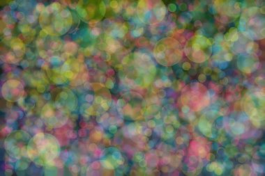 Birden fazla rengin soyut arkaplanı: mavi, pembe ve sarı ve bunların karışımı. Bokeh noktaları