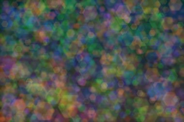 yeşil, turuncu ve mavi soyut çözünmüş arkaplan altıgen şekilli bokeh benekleri