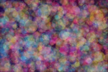 Bokeh ile soyut bir arkaplan. Yumuşak ışık odaklı noktalar.