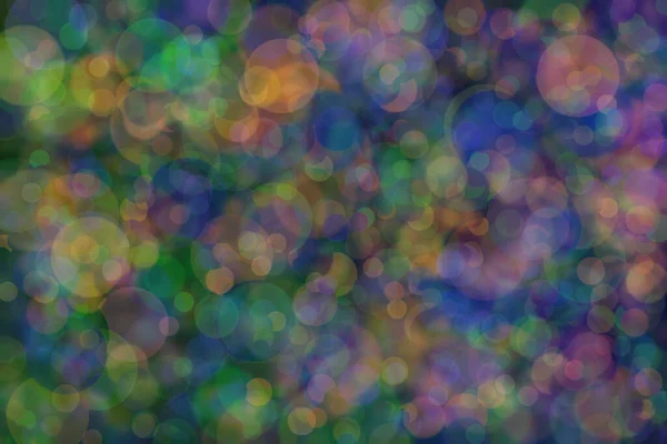Abstract background of three colors: green, orange and blue and their mixture. Bokeh