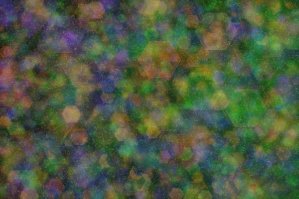 Abstract background of three colors: green, orange and blue and their mixture. Bokeh