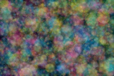 Bokeh ile soyut bir arkaplan. Yumuşak ışık odaklı noktalar.