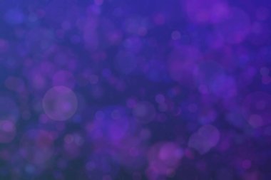 Bokeh ile soyut bir arkaplan. Yumuşak ışık odaklı noktalar.