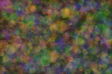 Üç rengin soyut arkaplanı: yeşil, turuncu ve mavi ve bunların karışımı. Bokeh