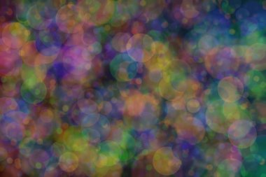 yeşil, turuncu ve mavi soyut çözünmüş arka plan daire şeklindeki bokeh noktalarıyla