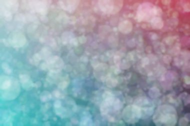 Daire şeklinde bokeh noktaları olan renkli bir arkaplan. Soyutlama
