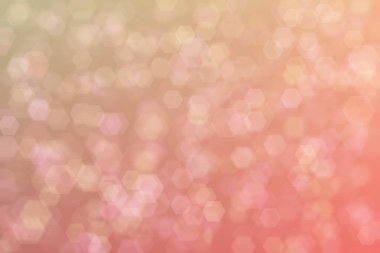 Soyut bokeh arka planında kırmızı mercan altıgen şekilli noktalar.