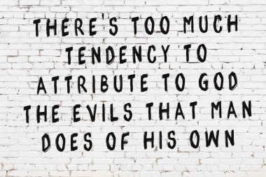 Beyaz tuğla duvar ve bilgece alıntıların yazılı olduğu siyah yazı.