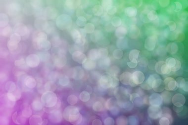 Daire şeklinde bokeh noktaları olan renkli bir arkaplan. Soyutlama