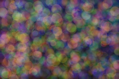 Bokeh ile soyut bir arkaplan. Yumuşak ışık odaklı noktalar.