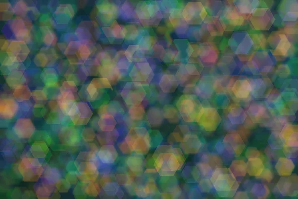 Abstract background of three colors: green, orange and blue and their mixture. Bokeh