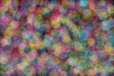 mavi, pembe ve sarı soyut çözünmüş arka plan daire şeklindeki bokeh noktalarıyla