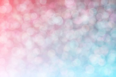 Pembe ve mavi soyutlanmış arka plan daire şeklindeki bokeh noktalarıyla