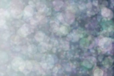 Daire şeklinde bokeh noktaları olan renkli bir arkaplan. Soyutlama