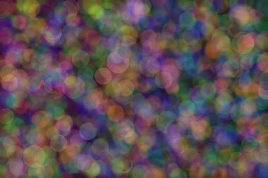 Bokeh ile soyut bir arkaplan. Yumuşak ışık odaklı noktalar.