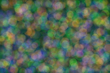 Bokeh ile soyut bir arkaplan. Yumuşak ışık odaklı noktalar.