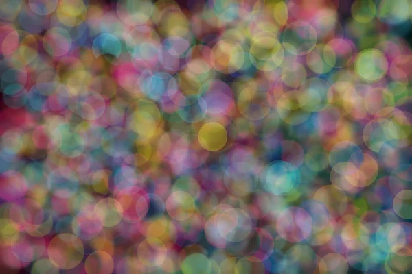 blue, pink and yellow abstract defocused background with circle shape bokeh spots