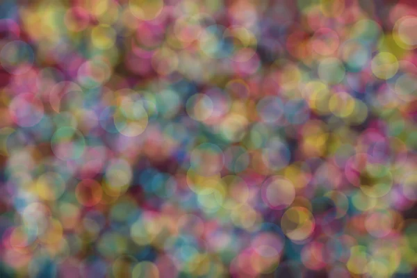 blue, pink and yellow abstract defocused background with circle shape bokeh spots