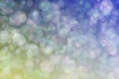 Daire şeklinde bokeh noktaları olan renkli bir arkaplan. Soyutlama