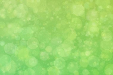 Çember şekilli bokeh benekli yeşil soyut odaklanmış arkaplan