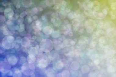 Daire şeklinde bokeh noktaları olan renkli bir arkaplan. Soyutlama
