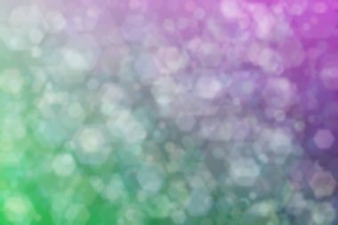 Altıgen şekilli bokeh benekleri olan renkli bir arkaplan. Soyutlama