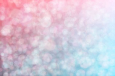 Pembe ve mavi soyutlanmış arka plan daire şeklindeki bokeh noktalarıyla