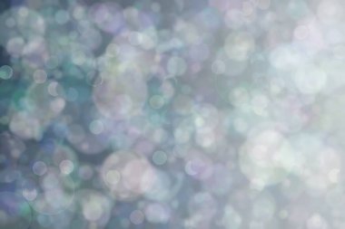 Bokeh ile soyut bir arkaplan. Yumuşak ışık odaklı noktalar.